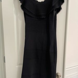 Beautiful black flutter off shoulder cocktail dress .